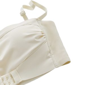 Sports bra anatomy diagram showing front and back construction, support panels, moisture-wicking fabric, flatlock seams, and wide underband.